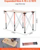 A portable folding workbench is shown in its expanded state, with dimensions and features highlighted. Voir les images du produit