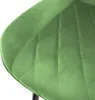 A close-up view of a green velvet chair seat with diamond quilting. Náhled obrázku produktu