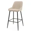 A beige bar stool with a chevron pattern on the backrest and black metal legs, isolated on a white background. Podgląd zdjęcia produktu