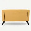 The back view of a yellow sofa with black legs against a white background. Náhled obrázku produktu