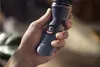 A hand holding a Philips electric shaver. Podgląd zdjęcia produktu