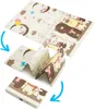 A folded baby play mat with cartoon animal illustrations. Produktbild-Vorschau