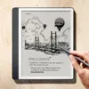 A hand is using a stylus to write on a Kindle Scribe, which displays a drawing and notes. Náhľad obrázku produktu