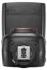 The back of a camera flash unit is shown, with regulatory markings and the hot shoe mount visible. Podgląd zdjęcia produktu