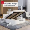 A white bed frame with the mattress lifted to show the storage space underneath, in a bedroom setting. Produktbild-Vorschau