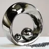 Socha SPIN - striebro - keramika - v. 22cm x d. 6cm x š. Náhľad obrázku produktu 1