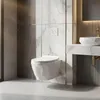 A modern bathroom with a wall-mounted toilet and a sink. Podgląd zdjęcia produktu