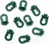 A collection of green plastic clips on a white background. Voir les images du produit