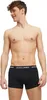 A man is shown from the chest down, wearing black boxer briefs. Produktbild-Vorschau