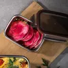 A close-up shot of a Cuitisan FLORA 300ml rectangular container filled with sliced red radishes in brine, placed on a wooden cutting board. Anteprima dell’immagine prodotto