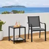A patio table and chair set on a wooden deck overlooking the ocean. Produktbild-Vorschau