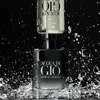 Two bottles of Giorgio Armani Acqua di Gio perfume are shown with water splashing around them against a black background. Anteprima dell’immagine prodotto