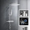 A modern shower system with a square overhead shower head and a handheld shower head, mounted on a wall. An inset image shows stainless steel tubes and a scale measuring weight. Náhled obrázku produktu