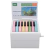 A white piano-shaped calendar with colorful keys and a picture of a castle in the sky. Produktbild-Vorschau