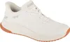 A white Skechers slip-on sneaker with a brown sole, shown from the side. Anteprima dell’immagine prodotto
