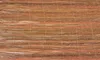 A close-up view of a woven mat made of thin branches or reeds. Náhľad obrázku produktu