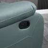 A close-up of a recliner chair's armrest, showing the reclining lever. Podgląd zdjęcia produktu