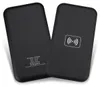 Two black wireless chargers are shown on a white background. One charger is shown from the back with text and logos, and the other is shown from the front with a wireless charging symbol. Produktbild-Vorschau