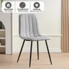 A gray upholstered chair with black metal legs is shown in a room. Produktbild-Vorschau