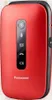 A red flip phone is shown from the front against a white background. Náhľad obrázku produktu