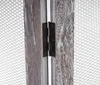A close-up view of a wooden room divider hinge and mesh screen. Voir les images du produit