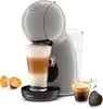 A coffee machine with a cup of coffee and coffee pods. Náhled obrázku produktu