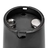Close-up view of the interior of a black cylindrical object, showing two metal screws or bolts with hexagonal heads and nuts, set against a textured black surface. Náhled obrázku produktu