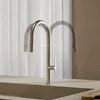 A modern kitchen faucet shown in a neutral setting with sheer curtains in the background. Produktbild-Vorschau