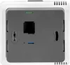 The back of a white and gray thermostat device is shown against a white background. Voir les images du produit