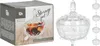A clear product shot of a glass storage pot with a lid, filled with dried fruit, next to its packaging. Several other similar glass pots are shown in a vertical row on the right. Anteprima dell’immagine prodotto