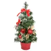 A small, decorated Christmas tree in a red pot. Voir les images du produit