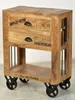 A vintage-style wooden side table with drawers and metal wheels. Podgląd zdjęcia produktu