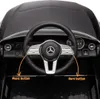 Close-up view of the steering wheel and dashboard of a toy Mercedes car. Produktbild-Vorschau