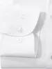 A close-up view of the cuff and buttons of a white long-sleeved shirt. Produktbild-Vorschau