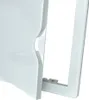 A close-up of a white plastic inspection door with a frame. Náhled obrázku produktu