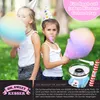 Two young girls in party hats are enjoying cotton candy made from a blue cotton candy machine. Produktbild-Vorschau