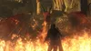 A person stands in front of a large, red dragon surrounded by flames. Produktbild-Vorschau