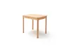 A light brown wooden table with four legs, isolated on a white background. Produktbild-Vorschau