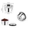 Product shots of a stainless steel coffee capsule with dimensions indicated, along with a capsule filled with coffee grounds and a separate lid. Produktbild-Vorschau
