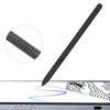 A black stylus pen is shown diagonally across the image, with a close-up inset of its button. The stylus is positioned above a tablet screen where it is drawing a purple line. Produktbild-Vorschau