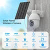 A solar-powered wireless security camera mounted on a wall, with a solar panel attached. Produktbild-Vorschau