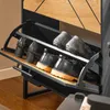 A close-up view of a shoe cabinet with multiple shelves and shoes on display. Produktbild-Vorschau