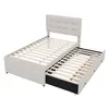 A beige upholstered bed frame with a pull-out trundle bed underneath, shown against a white background. Náhled obrázku produktu