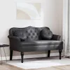 A black Chesterfield bench is shown in a room with a painting on the wall and a small side table. Náhľad obrázku produktu