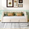 A beige upholstered sofa bed with green and brown accent pillows is shown in a room with framed artwork on the wall. Anteprima dell’immagine prodotto