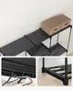 Close-up shots of a black modular shelving unit with brown boxes on top and a detail of hanging clothes. Náhled obrázku produktu