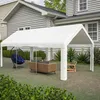 A white party tent set up in a backyard with outdoor furniture. Produktbild-Vorschau