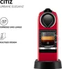 A red Nespresso coffee machine with a cup of coffee in it. Anteprima dell’immagine prodotto