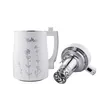 A white jug with a handle, decorated with silver floral patterns, stands next to a separate silver and white appliance component with a metal strainer at the end. Podgląd zdjęcia produktu