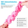 A hand is squeezing a pink silicone mold for dog treats, showing its flexibility. Produktbild-Vorschau